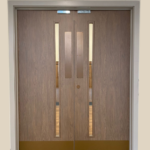 Architectural vinyl wrapping of doors in office