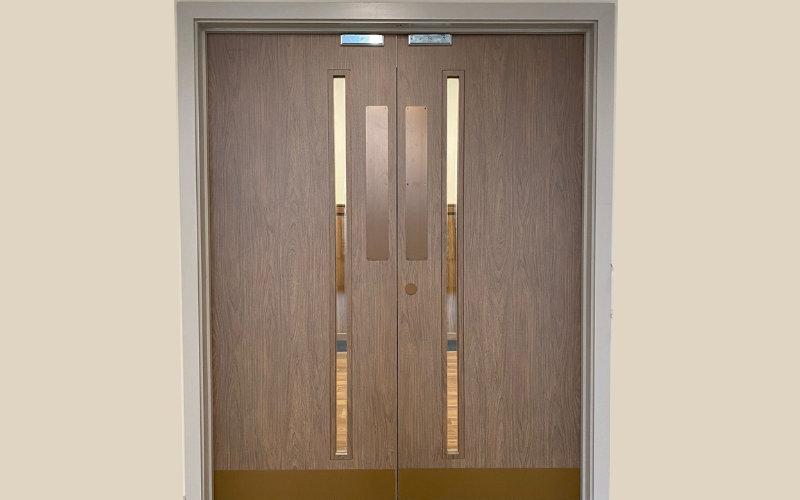 Architectural vinyl wrapping of doors in office