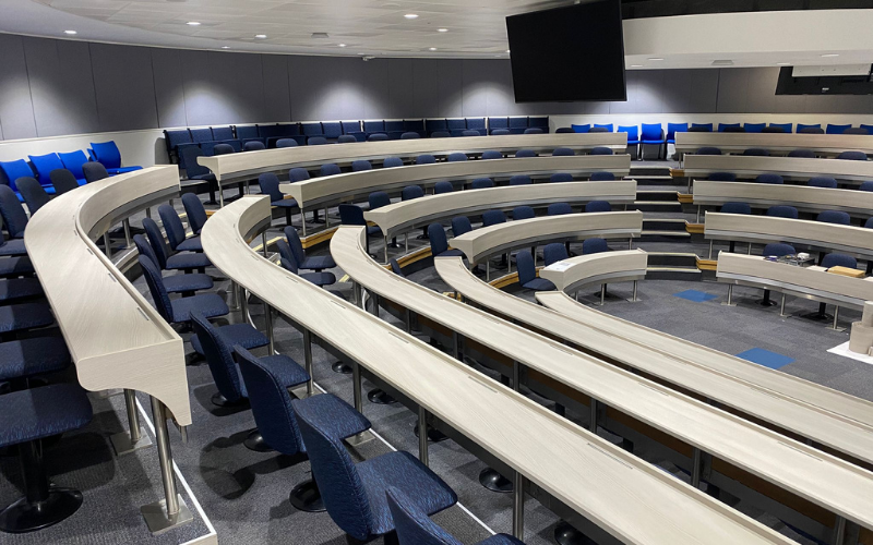 Architectural vinyl wrapping lecture theatre desks at university